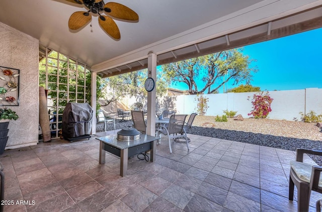 view of patio / terrace with ceiling fan and a grill