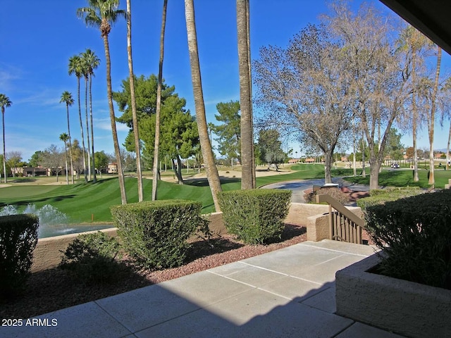 view of home's community featuring a lawn