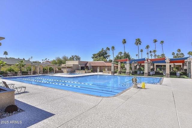 view of swimming pool featuring a patio