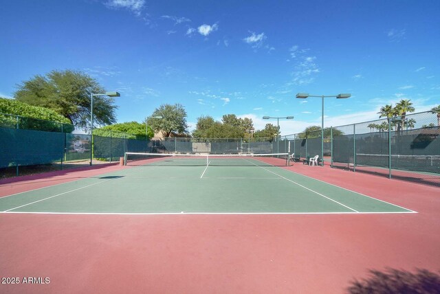 view of sport court with basketball hoop