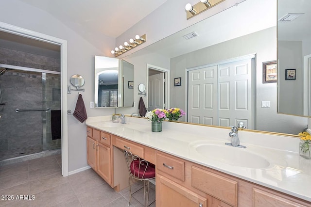 bathroom featuring tile patterned flooring, vanity, and an enclosed shower