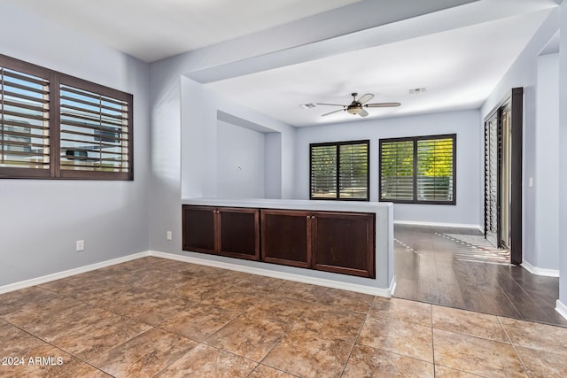 unfurnished room with hardwood / wood-style floors and ceiling fan