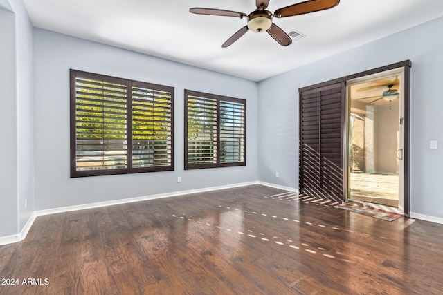 unfurnished room featuring dark hardwood / wood-style floors