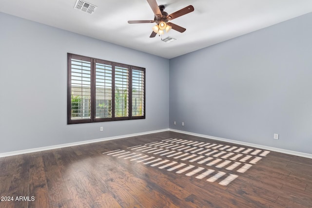 unfurnished room featuring ceiling fan and dark hardwood / wood-style floors