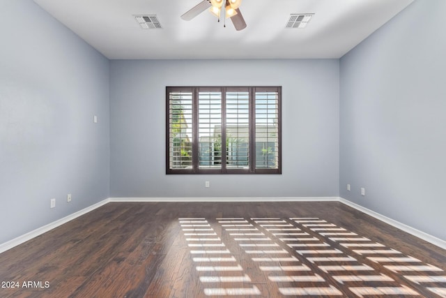 unfurnished room featuring ceiling fan and dark hardwood / wood-style flooring