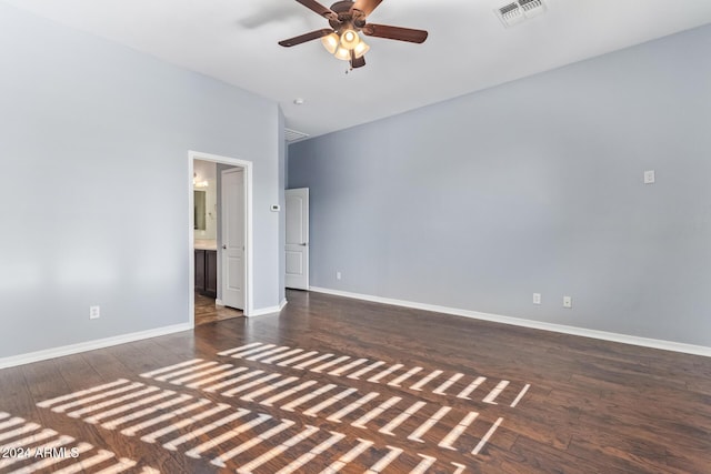 empty room featuring dark hardwood / wood-style floors, ceiling fan, and high vaulted ceiling