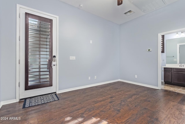 interior space with dark hardwood / wood-style floors and ceiling fan