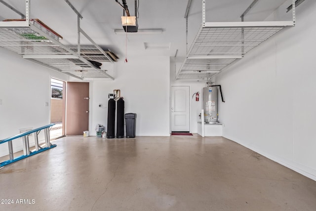 garage with a garage door opener and gas water heater