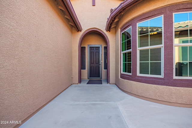 entrance to property with a patio area