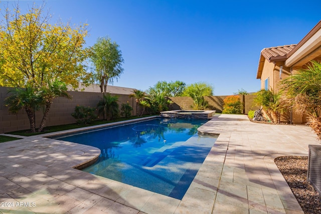 view of pool featuring a patio area and an in ground hot tub