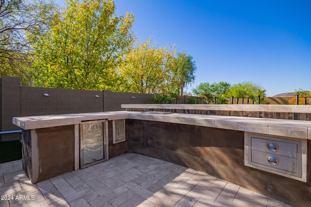 view of patio with an outdoor kitchen