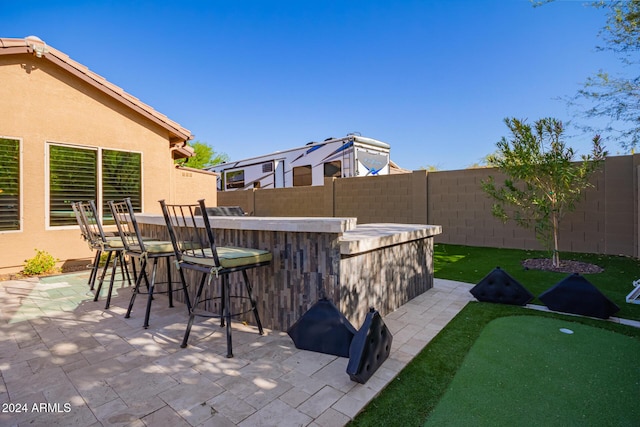 view of patio featuring a bar