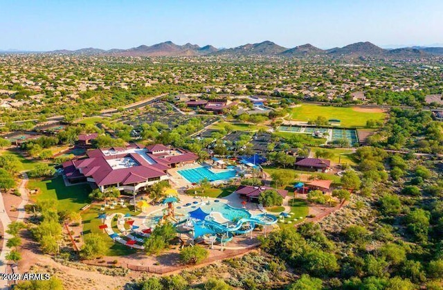 birds eye view of property with a mountain view