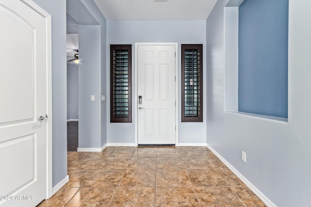 entryway featuring ceiling fan