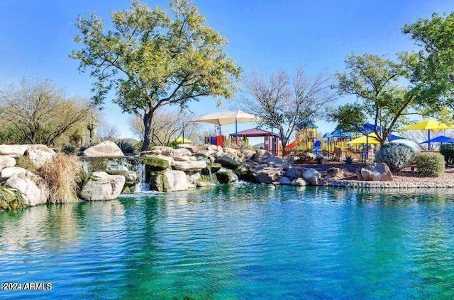 view of pool featuring a playground