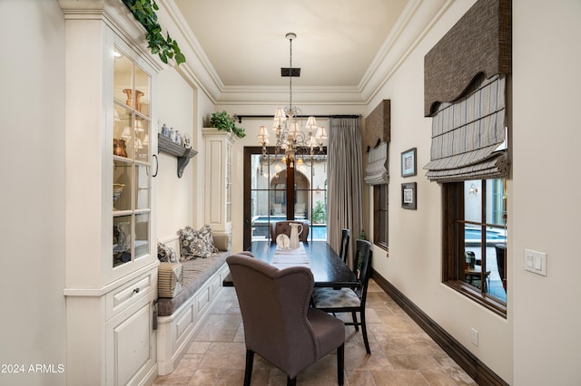 dining room featuring a chandelier, a healthy amount of sunlight, and ornamental molding