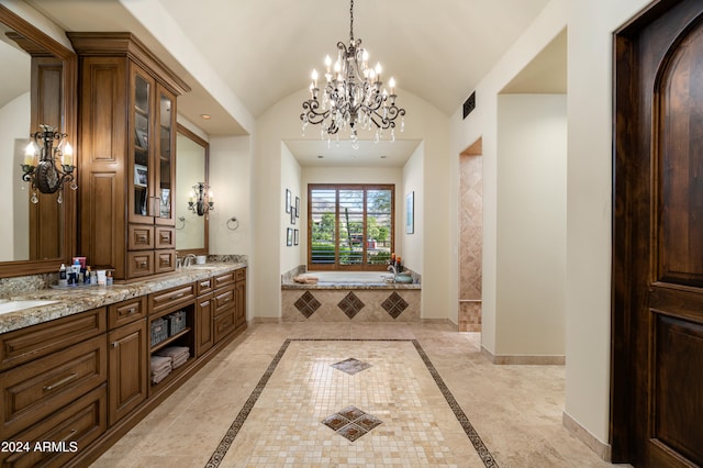 bathroom with a chandelier, vanity, a relaxing tiled tub, and lofted ceiling