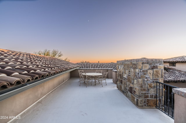 view of patio terrace at dusk