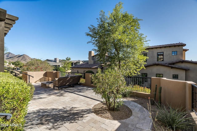 view of patio with a mountain view and an outdoor living space