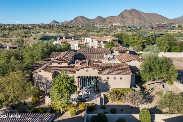 birds eye view of property with a mountain view