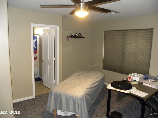 carpeted bedroom with ceiling fan