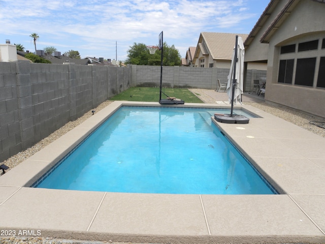 view of swimming pool featuring a patio area