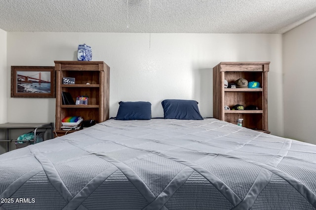 bedroom featuring a textured ceiling