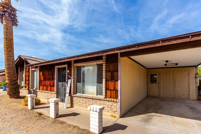 view of front of home with a carport