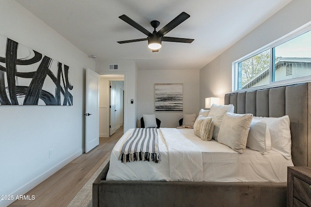 bedroom with ceiling fan and light hardwood / wood-style floors