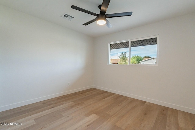 unfurnished room featuring ceiling fan and light hardwood / wood-style floors