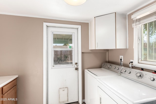 laundry room featuring cabinet space and washer and clothes dryer