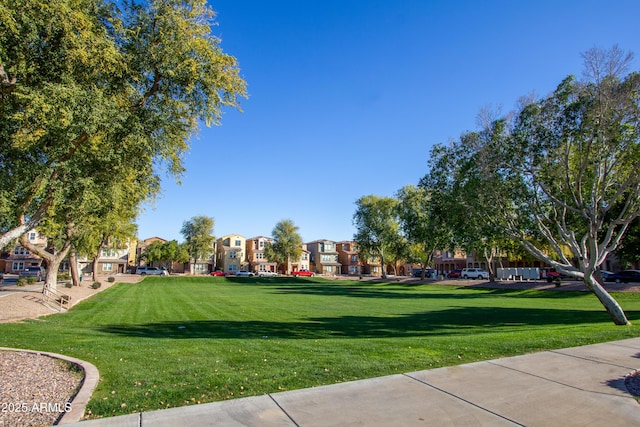 view of property's community with a lawn