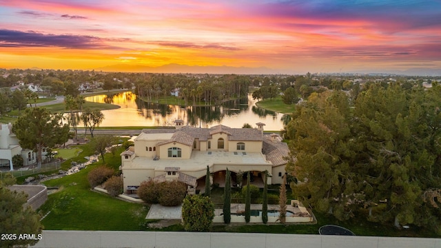 birds eye view of property featuring a water view