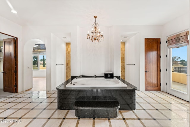 bathroom featuring a bath and recessed lighting