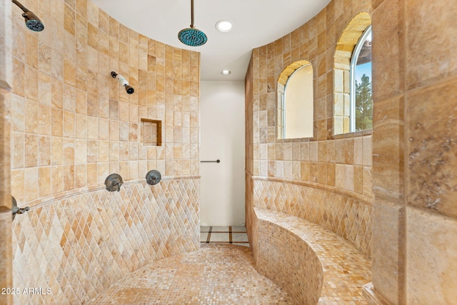 bathroom with recessed lighting and a tile shower