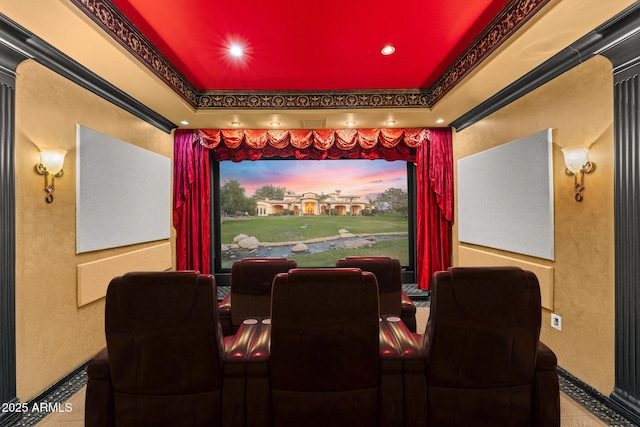 cinema room featuring recessed lighting and a tray ceiling