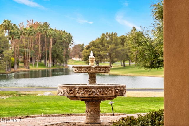 surrounding community featuring a yard and a water view