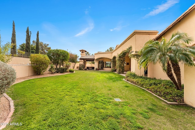 view of yard with a fenced backyard and a patio