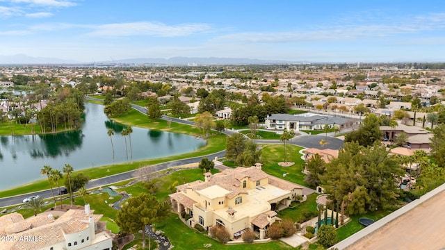 drone / aerial view featuring a water view and a residential view