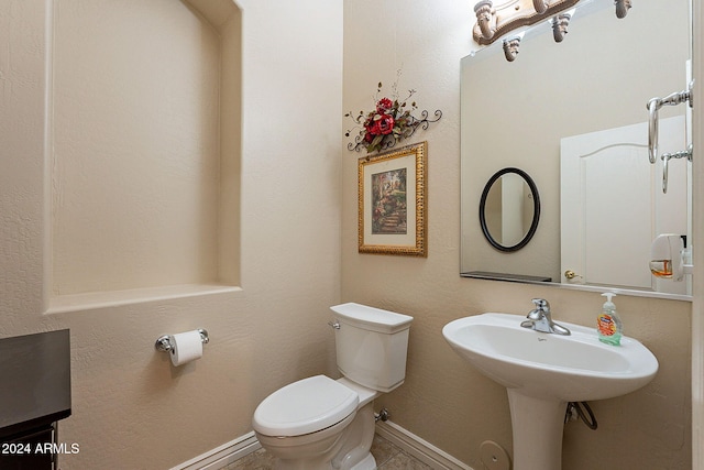 bathroom featuring toilet and sink