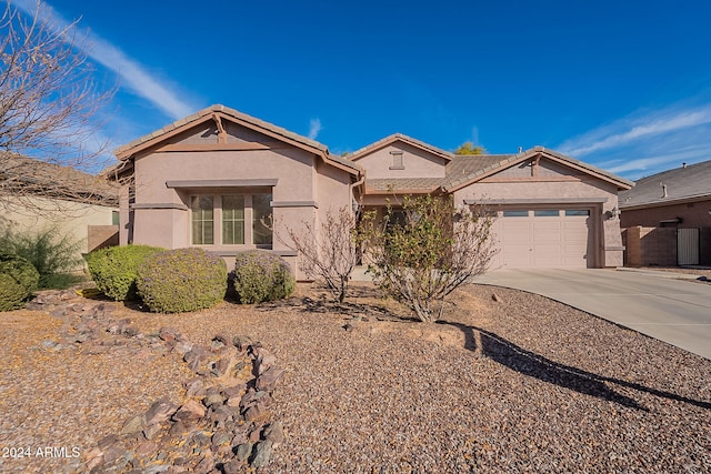 single story home featuring a garage