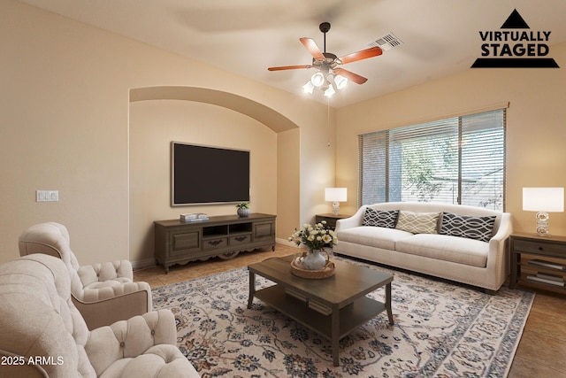 living room with tile patterned floors and ceiling fan