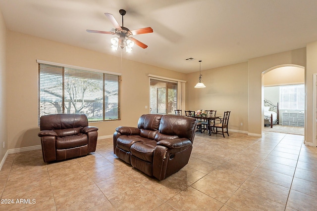 living room featuring ceiling fan and light tile patterned flooring