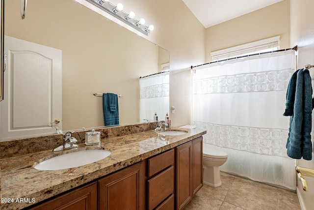 bathroom with tile patterned flooring, a shower with curtain, vanity, and toilet