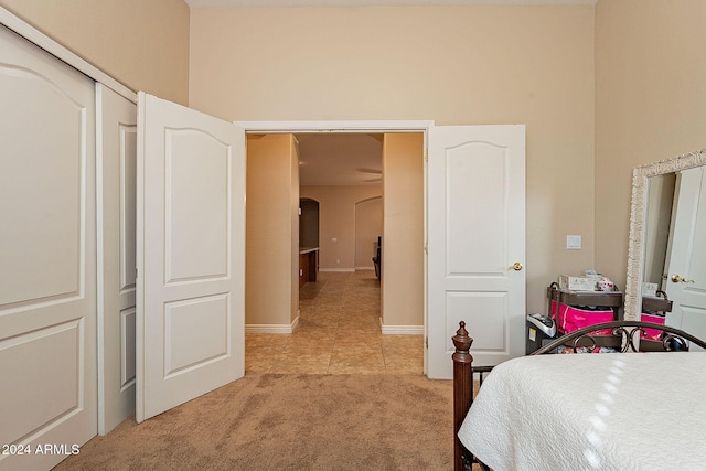 carpeted bedroom with a closet