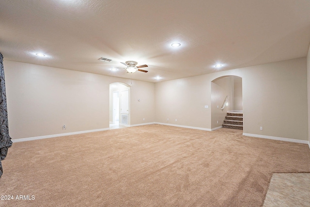 carpeted empty room featuring ceiling fan