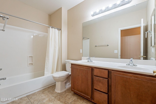 full bathroom featuring tile patterned flooring, shower / tub combo with curtain, vanity, and toilet