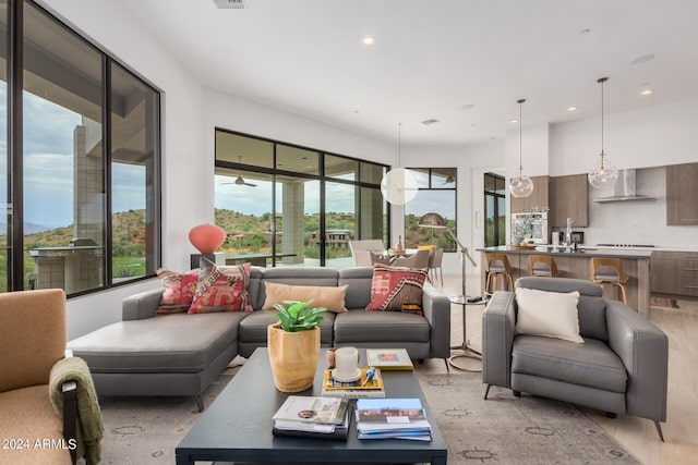 living area featuring recessed lighting and visible vents