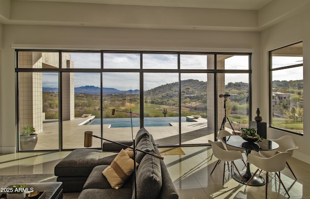 sunroom / solarium with a mountain view