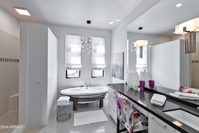 full bathroom with a sink, an inviting chandelier, and a walk in shower